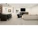 Finished basement with bar, fireplace, tv and cozy seating area, perfect for entertaining at 20 Viking Dr, Cherry Hills Village, CO 80113