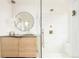 Bathroom with wooden vanity, modern fixtures, and large glass enclosed shower at 20 Viking Dr, Cherry Hills Village, CO 80113