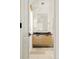 Bathroom with a light wood vanity and a glass shower with natural stone floors at 20 Viking Dr, Cherry Hills Village, CO 80113
