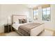 Cozy bedroom with natural light, neutral tones, and stylish decor for a relaxing ambiance at 20 Viking Dr, Cherry Hills Village, CO 80113