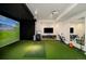 Large bonus room with a golf simulator and media area providing an immersive experience at 20 Viking Dr, Cherry Hills Village, CO 80113
