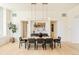 Modern dining room with hardwood floors, contemporary light fixture, and neutral paint at 20 Viking Dr, Cherry Hills Village, CO 80113