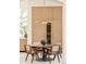 Eat-in kitchen dining nook with modern pendant lighting and integrated wine fridge at 20 Viking Dr, Cherry Hills Village, CO 80113