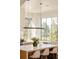 Bright and airy kitchen with large windows and contemporary pendant lighting at 20 Viking Dr, Cherry Hills Village, CO 80113