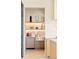 Cozy kitchen nook featuring stylish décor on illuminated shelving at 20 Viking Dr, Cherry Hills Village, CO 80113