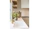 Modern kitchen with stylish gold faucet and bright white farmhouse sink at 20 Viking Dr, Cherry Hills Village, CO 80113