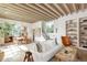 Bright living room with beamed ceiling, open floor plan, and stylish decor at 20 Viking Dr, Cherry Hills Village, CO 80113
