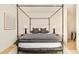 This main bedroom features a four poster bed with a muted color scheme and wood floors at 20 Viking Dr, Cherry Hills Village, CO 80113