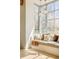 Corner window seat with many pillows, large windows, and beautiful view at 20 Viking Dr, Cherry Hills Village, CO 80113