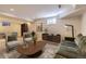 Inviting basement living area with stylish furnishings, warm lighting, and neutral color palette at 286 Warwick Pl, Castle Pines, CO 80108