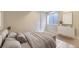 Well-lit bedroom with full length mirror, featuring soft natural tones and textures at 286 Warwick Pl, Castle Pines, CO 80108