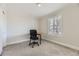 Neutral room with a chair, desk, and sunny window, suitable for a bedroom or office at 286 Warwick Pl, Castle Pines, CO 80108
