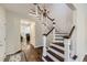 Welcoming entryway features hardwood floors, stairs to the second floor, and access to living spaces at 286 Warwick Pl, Castle Pines, CO 80108