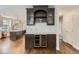 This kitchen offers a built-in wine rack and shelving space adjacent to a large kitchen with an island at 286 Warwick Pl, Castle Pines, CO 80108