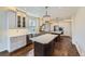 This spacious kitchen is highlighted by modern appliances, pendant lighting, and wood floors at 286 Warwick Pl, Castle Pines, CO 80108