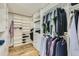 Spacious walk-in closet with custom shelving and storage for clothing and accessories at 286 Warwick Pl, Castle Pines, CO 80108