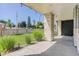 Landscaped backyard with grass, ornamental grasses, and a wooden fence at 5601 E Iowa Ave, Denver, CO 80224