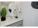 Modern bathroom with gray vanity and white countertop at 5601 E Iowa Ave, Denver, CO 80224