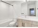 Modern basement bathroom with a tub and vanity at 5601 E Iowa Ave, Denver, CO 80224