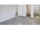 Simple bedroom with access to a bathroom and closet at 5601 E Iowa Ave, Denver, CO 80224