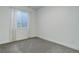 Simple, bright basement bedroom with window and carpet at 5601 E Iowa Ave, Denver, CO 80224
