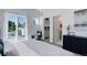 Bright bedroom with private deck access and walk-in closet at 5601 E Iowa Ave, Denver, CO 80224