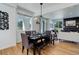 Modern dining area with dark wood table and bench seating at 5601 E Iowa Ave, Denver, CO 80224