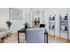 Bright home office with a desk and view into the kitchen at 5601 E Iowa Ave, Denver, CO 80224