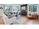 Spacious living room with hardwood floors and fireplace at 5601 E Iowa Ave, Denver, CO 80224