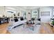 Open concept living area with hardwood floors and stylish decor at 5601 E Iowa Ave, Denver, CO 80224