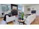 Bright living room features a fireplace and hardwood floors at 5601 E Iowa Ave, Denver, CO 80224