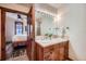 Modern bathroom featuring double sinks and vanity adjacent to bedroom with wood accents at 505 S Main St # 1313, Breckenridge, CO 80424