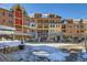 Attractive multi-story building with shops, snow and blue skies on a sunny day at 505 S Main St # 1313, Breckenridge, CO 80424