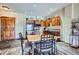 Charming kitchen and dining area with wood cabinets, a black fridge, and stone floors at 505 S Main St # 1313, Breckenridge, CO 80424