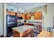 Kitchen featuring wood cabinetry, granite countertops, and stainless steel appliances at 505 S Main St # 1313, Breckenridge, CO 80424