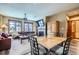 Inviting living room and dining area with a fireplace, ceiling fan, and wood accents at 505 S Main St # 1313, Breckenridge, CO 80424