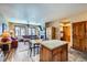 Bright and airy living room and dining area featuring wood floors and an island at 505 S Main St # 1313, Breckenridge, CO 80424