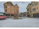 Exterior view of a town square with surrounding retail establishments and walkways in winter at 505 S Main St # 1313, Breckenridge, CO 80424