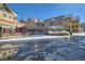 Exterior shot of a snow-covered town square with restaurants and multi-story buildings at 505 S Main St # 1313, Breckenridge, CO 80424