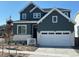 Beautiful two-story home with a two car garage, light stone accents, and a well-manicured lawn at 17719 Prairie Peak Trl, Parker, CO 80134