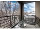 Relaxing balcony view complete with outdoor seating and a stylish glass-topped table at 2334 Lowell Blvd, Denver, CO 80211