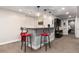 Finished basement bar area with stylish pendant lighting and modern red bar stool seating at 2334 Lowell Blvd, Denver, CO 80211