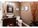 Modern powder room featuring unique vessel sink and dark wood cabinets at 2334 Lowell Blvd, Denver, CO 80211