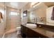 Stylish bathroom with a glass-enclosed shower and modern vanity with a vessel sink at 2334 Lowell Blvd, Denver, CO 80211