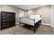 Bedroom with metal frame bed, a dresser and a window at 2334 Lowell Blvd, Denver, CO 80211