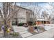 Modern two-story home featuring stone accents, walkway and chairs at 2334 Lowell Blvd, Denver, CO 80211