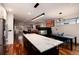 Modern kitchen featuring a large island, stainless steel appliances, and hardwood floors at 2334 Lowell Blvd, Denver, CO 80211