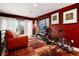 Stylish living area with red walls, hardwood floors, comfortable seating and balcony access at 2334 Lowell Blvd, Denver, CO 80211