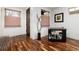 Modern living space featuring hardwood floors, bar cart, and natural light at 2334 Lowell Blvd, Denver, CO 80211