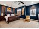 Luxurious main bedroom with a dark accent wall, large windows, and a plush carpet at 2334 Lowell Blvd, Denver, CO 80211